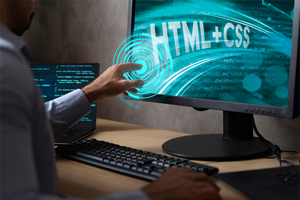 A person working on graphic design software with various design elements on the screen